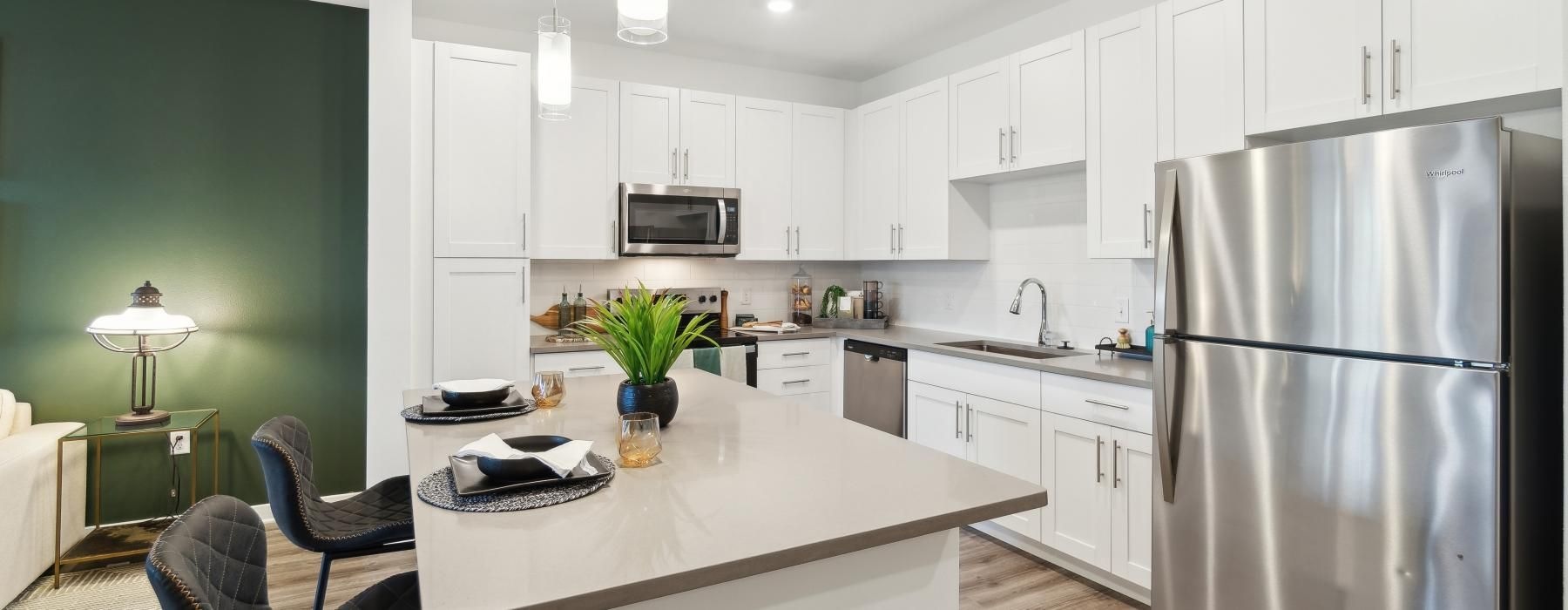 a kitchen with white cabinets