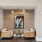 a room with a couch and a painting on the wall