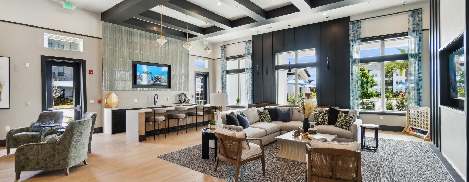 Settle into comfort at Ascend at Clay Town Center a large living room with a large glass wall