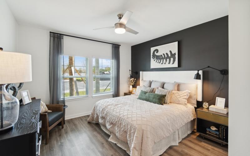 Relax and recharge in beautiful and spacious bedrooms a bedroom with a large window