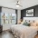a bedroom with a large window