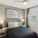 a bedroom with a large window